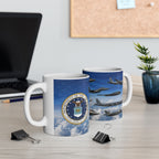 two white mugs with the United States Air Force seal on them, placed on a desk with a laptop and some office supplies.