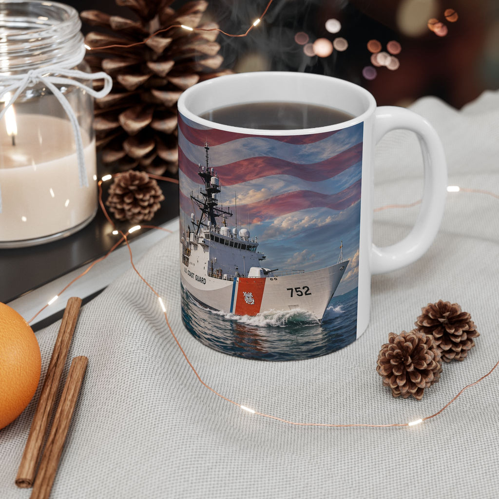 A mug with a picture of a ship on it, surrounded by pine cones and other holiday decorations.