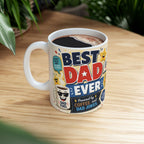 A white coffee mug with a colorful design featuring the text "BEST DAD EVER" and various cartoon-style icons.