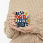 A person is holding a mug with the text "BEST DAD EVER" printed on it.