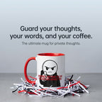 A mug with a cartoon character and text on it, placed on a pile of shredded paper.