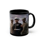 A black mug with a printed image of three military personnel in uniform, standing together and looking off into the distance.