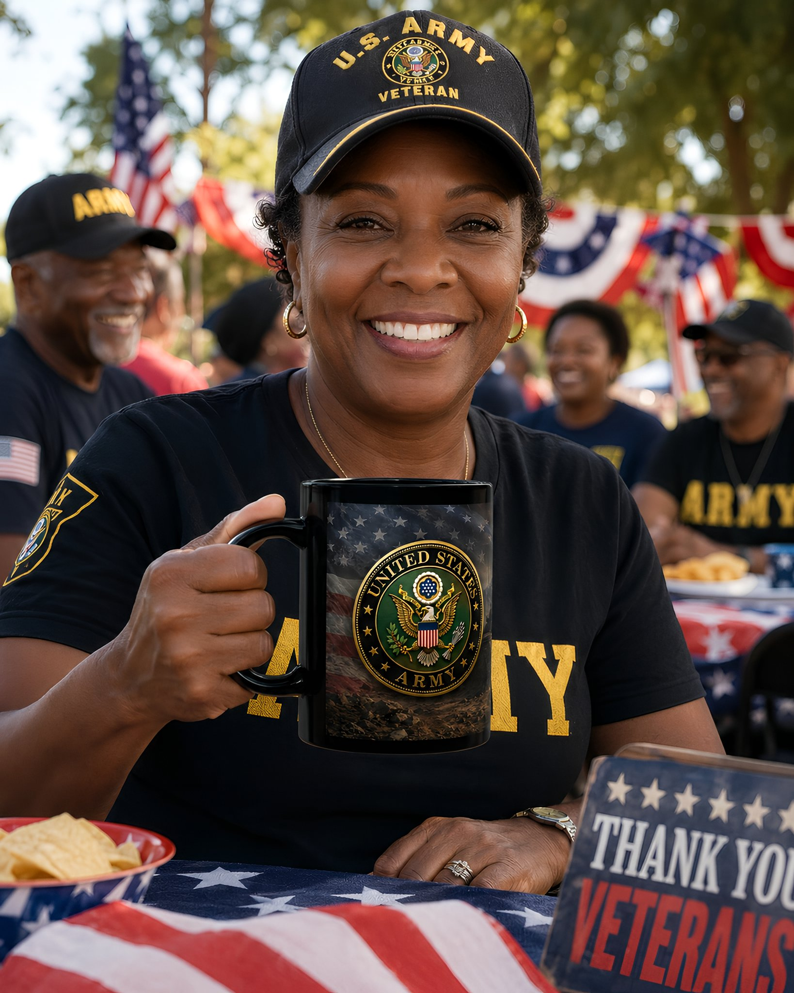 A smiling woman wearing a black t-shirt with a U.S. Army logo holds a mug with an American flag design, surrounded by other people and American flags in the background.