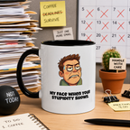 a mug with a cartoon character and text, surrounded by office supplies and a calendar on a desk.