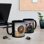 two black mugs with the United States Marine Corps logo, placed on a desk with a laptop, a plant, and some office supplies.