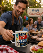 A man is holding a mug with a humorous Father's Day message, while a family is enjoying a barbecue outdoors with burgers and hot dogs.