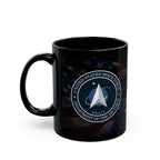 A black coffee mug with the United States Space Force logo printed on it.