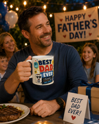 A man holding a mug with a "Best Dad Ever" design, smiling at a family gathering with a "Happy Father's Day!" banner in the background.