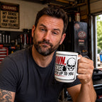 A man with a beard is holding a mug with a skull design and the text "OWN SENSE CHATCH UP TO YOU."