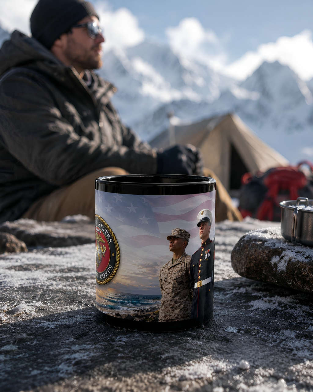 A mug featuring a military scene, including two soldiers and a flag, is placed on a snowy surface with a tent and mountains in the background.