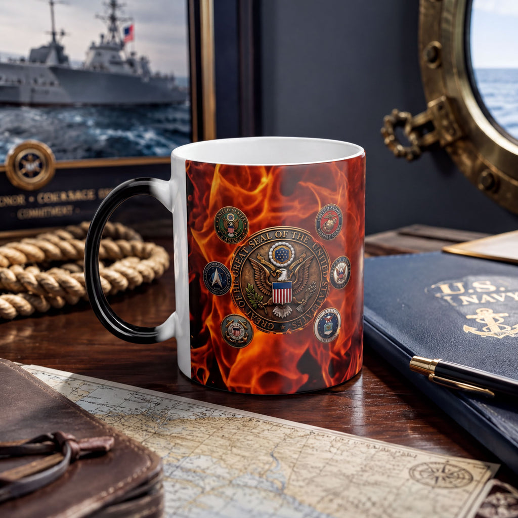 a mug with a design of the United States Navy seal on it, placed on a desk with various items such as a map, a pen, and a book.