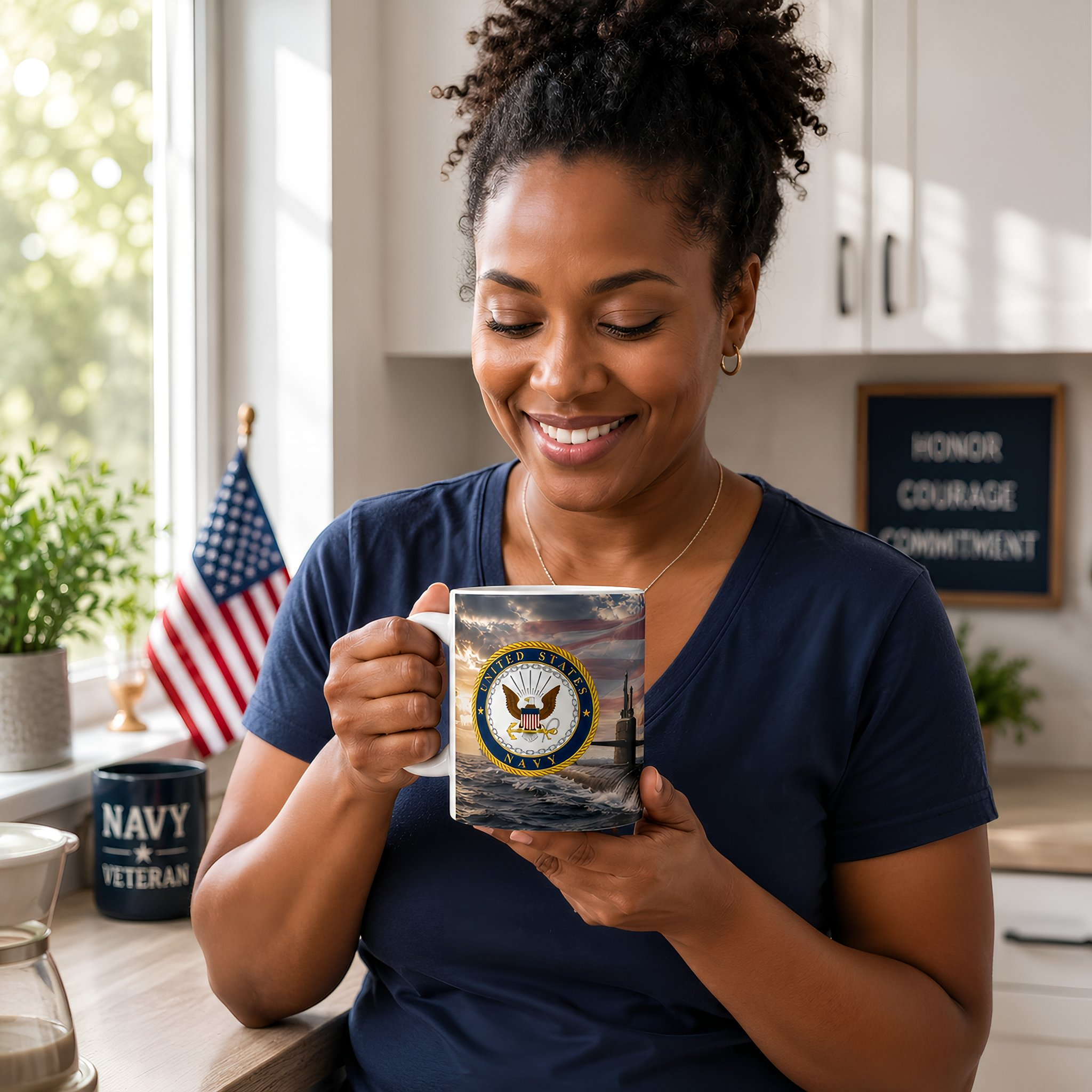A woman is holding a mug with the United States Navy seal logo, smiling and looking at the mug.
