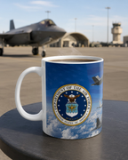 A mug with the emblem of the Department of the Air Force, featuring a fighter jet and clouds in the background.