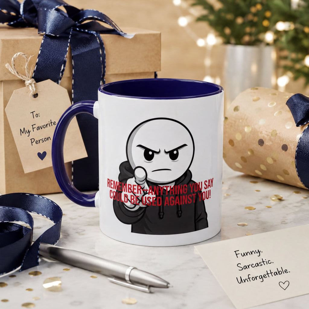 a mug with a cartoon character on it, along with a gift box, a pen, and a note.